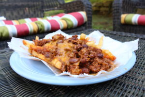  Checks Chili Fries- The chili cheese fries ($6.95) are one of Checks Cafe’s famous dishes. The golden brown fries are topped with an abundance of chili, meat, and melted cheddar cheese to complete their well-known chili dish. It is served in a basket instead of a plate adding to the dish’s uniqueness. 